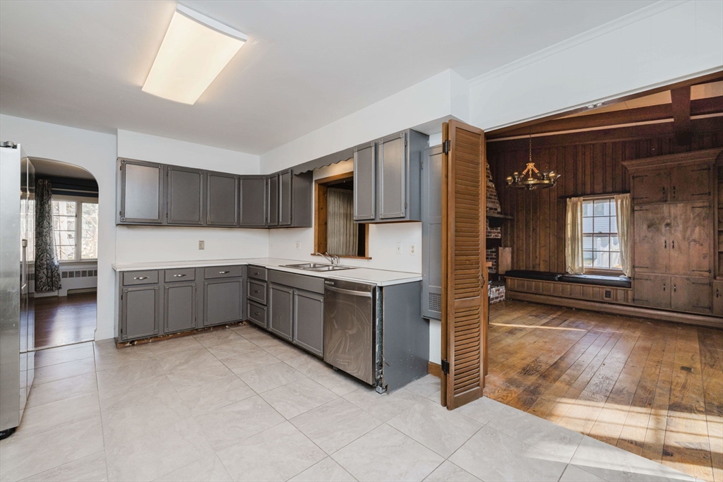 277 Valentine Street Fall River, MA 02720 - Photo 12 of 34 a kitchen with stainless steel appliances kitchen island granite countertop a refrigerator and a stove top oven
