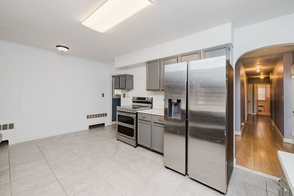 277 Valentine Street Fall River, MA 02720 - Photo 13 of 34 a kitchen with granite countertop a refrigerator and a sink