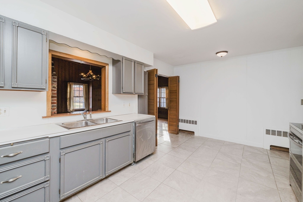 277 Valentine Street Fall River, MA 02720 - Photo 14 of 34 a bathroom with a double vanity sink and mirror