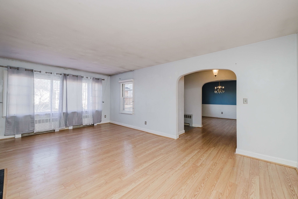 277 Valentine Street Fall River, MA 02720 - Photo 19 of 34 an empty room with wooden floor and windows