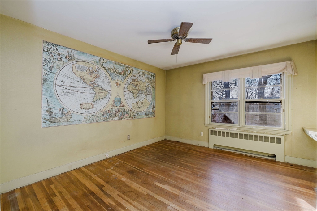 277 Valentine Street Fall River, MA 02720 - Photo 20 of 34 a view of a room with wooden floor closet and windows