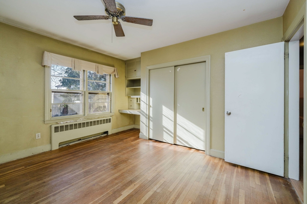 277 Valentine Street Fall River, MA 02720 - Photo 21 of 34 a view of an empty room with a window and wooden floor