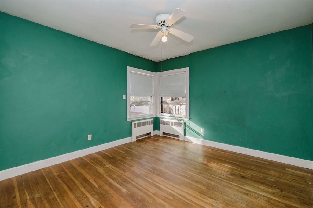 277 Valentine Street Fall River, MA 02720 - Photo 23 of 34 a view of a room with a ceiling fan and hardwood floor