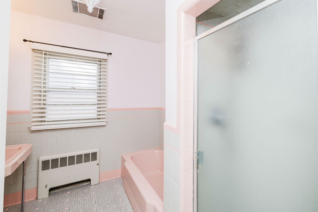 277 Valentine Street Fall River, MA 02720 - Photo 25 of 34 a bathroom with a bathtub and a window