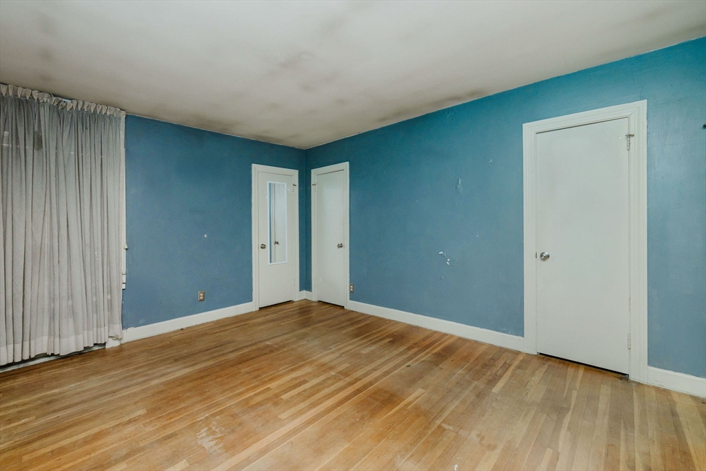 277 Valentine Street Fall River, MA 02720 - Photo 27 of 34 a view of an empty room with wooden floor