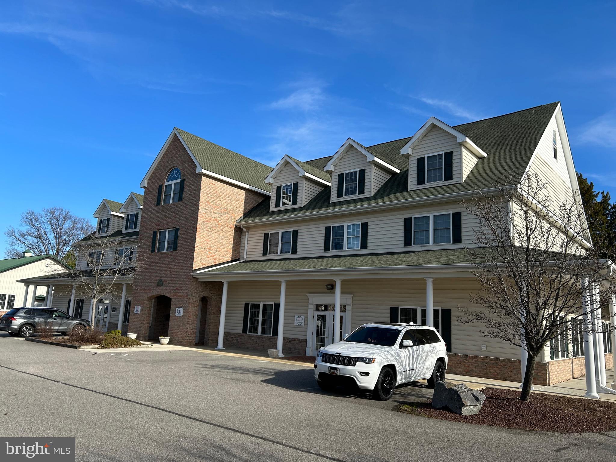 2201 Main Street, Unit 105 Chester, MD 21619 - Photo 2 of 2 a car parked in front of a building