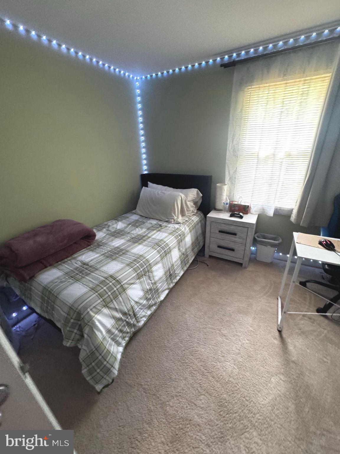 5718 Wood Mouse Court Burke, VA 22015 - Photo 15 of 23 a bedroom with a bed and a window