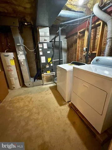 a view of a room with washer and dryer