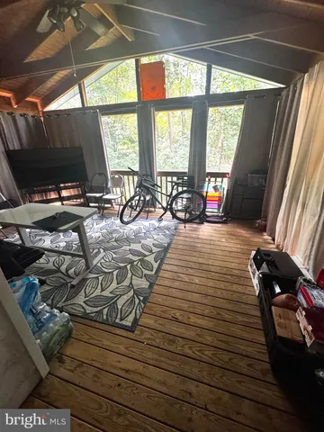 a room with furniture and a flat screen tv