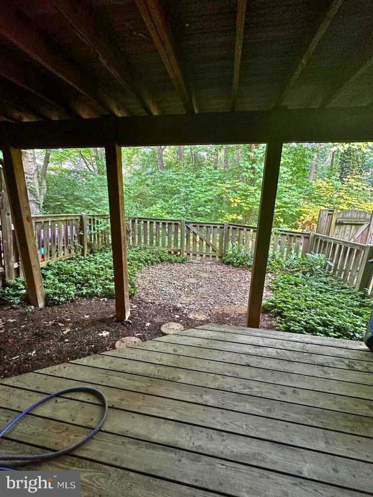 5718 Wood Mouse Court Burke, VA 22015 - Photo 22 of 23 a view of a room with wooden floor and outdoor space
