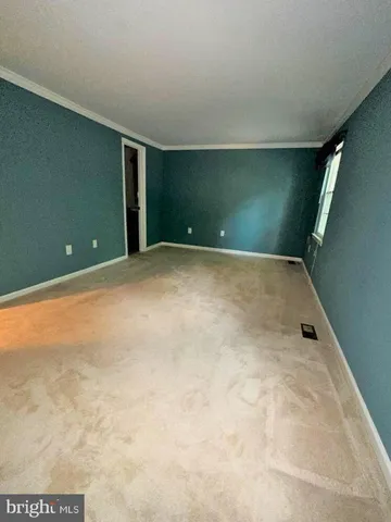 en empty room with windows