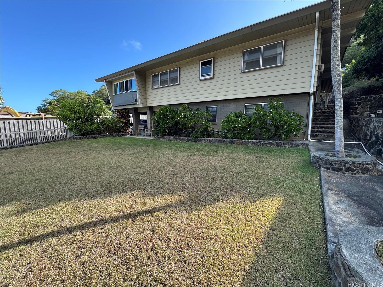 320 Hao Street Honolulu, HI 96821 - Photo 3 of 15 a front view of a house with garden