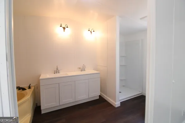 a bathroom with a sink and mirror