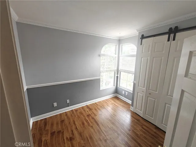 a view of entryway with wooden floor