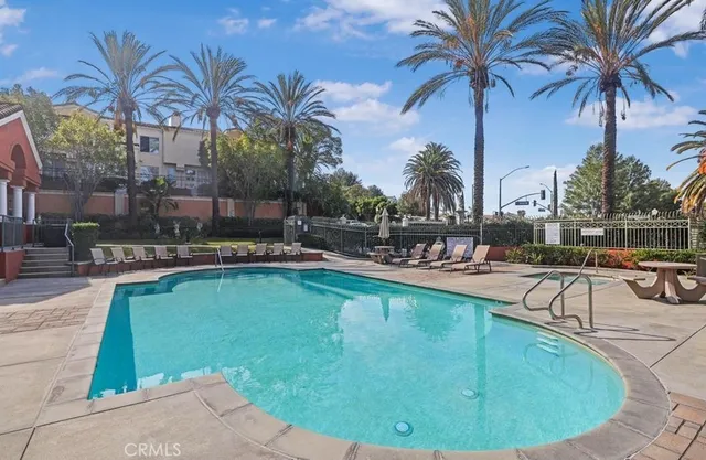 a view of a swimming pool with a sitting area