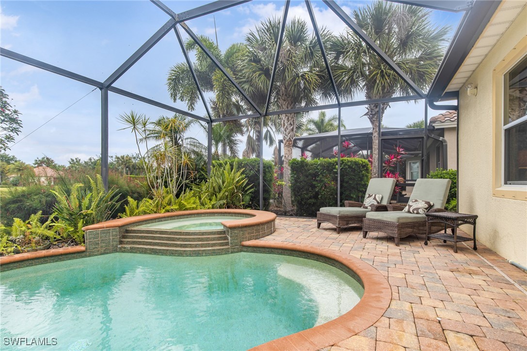a view of swimming pool with lounge chair