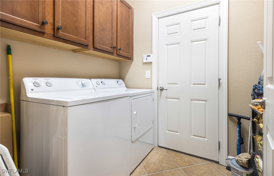 11208 Lithgow Lane Fort Myers, FL 33913 - Photo 18 of 49 a utility room with dryer and washer