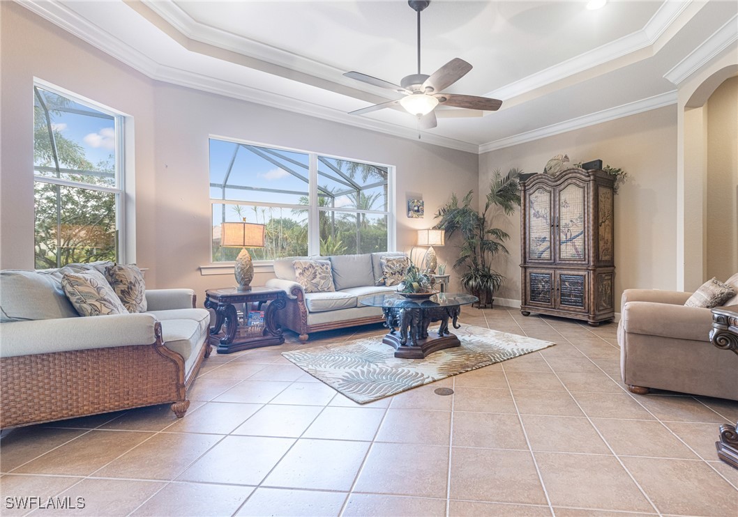 11208 Lithgow Lane Fort Myers, FL 33913 - Photo 19 of 49 a living room with furniture and a chandelier