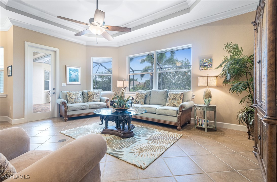 11208 Lithgow Lane Fort Myers, FL 33913 - Photo 20 of 49 a living room with furniture and a large window