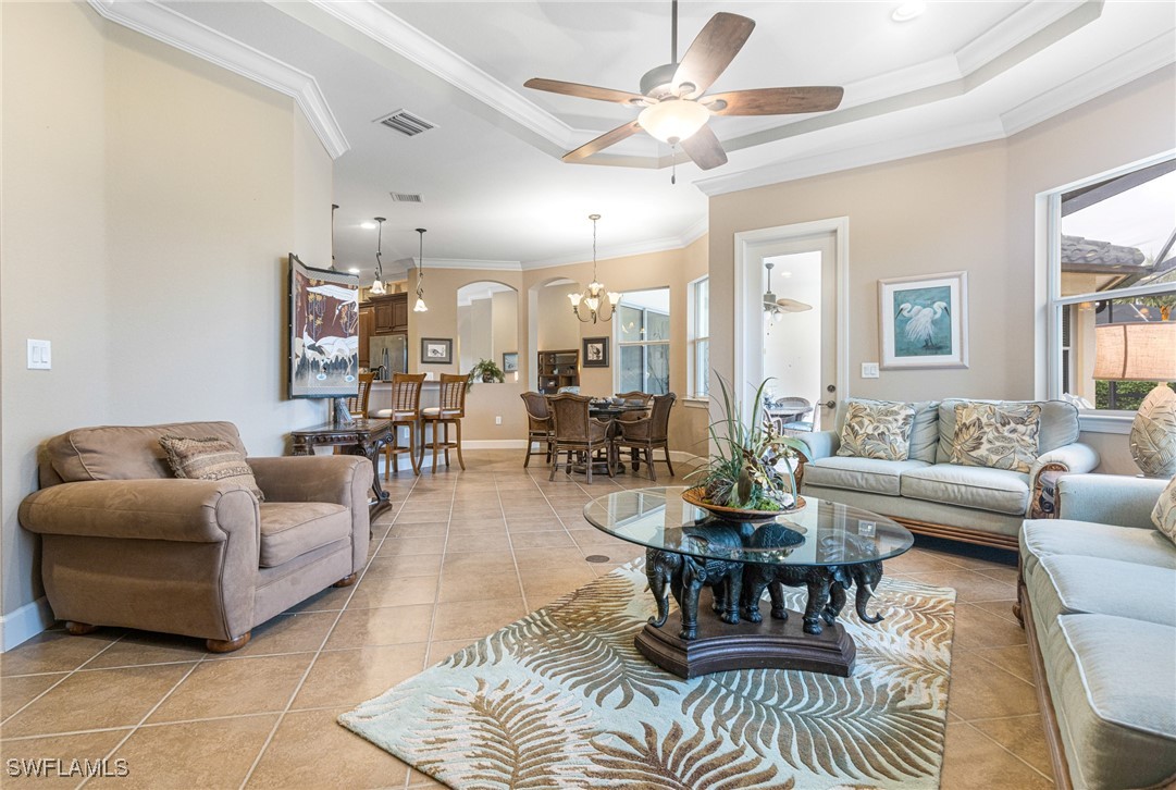11208 Lithgow Lane Fort Myers, FL 33913 - Photo 21 of 49 a living room with furniture and a large window