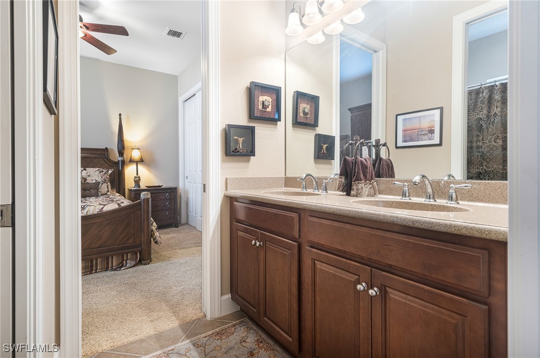 11208 Lithgow Lane Fort Myers, FL 33913 - Photo 25 of 49 a bathroom with a sink and a mirror