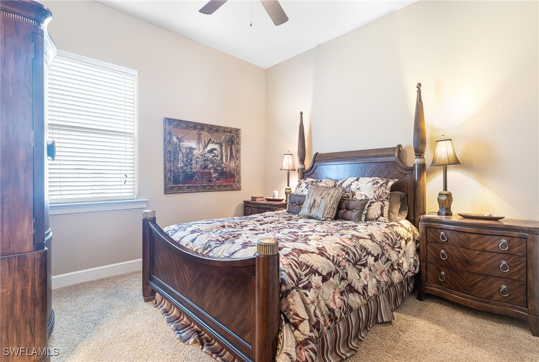 11208 Lithgow Lane Fort Myers, FL 33913 - Photo 28 of 49 a bedroom with a bed and a window