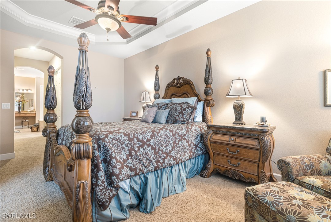 11208 Lithgow Lane Fort Myers, FL 33913 - Photo 33 of 49 a bedroom with a bed and ceiling fan