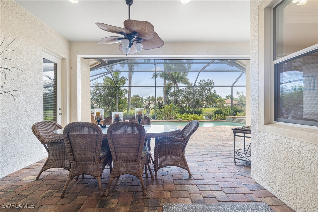 11208 Lithgow Lane Fort Myers, FL 33913 - Photo 38 of 49 a view of a dining room with furniture wooden floor and chandelier