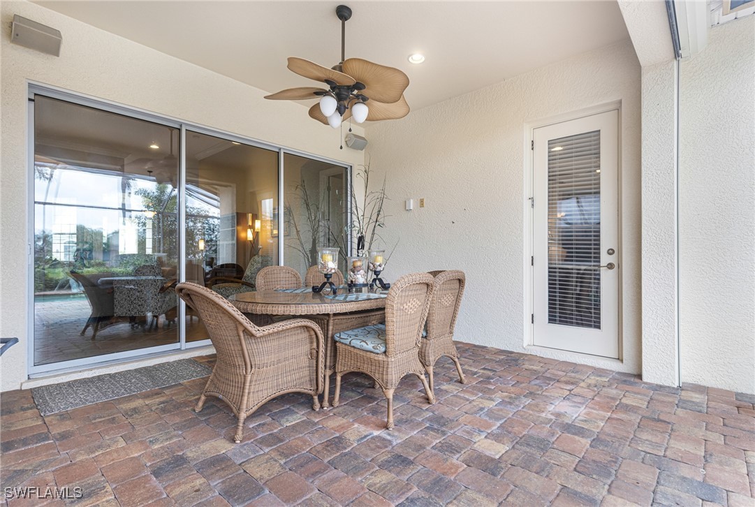 11208 Lithgow Lane Fort Myers, FL 33913 - Photo 40 of 49 a dining room with a table and chairs