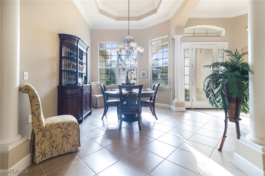 11208 Lithgow Lane Fort Myers, FL 33913 - Photo 4 of 49 a dining room with furniture and floor to ceiling window