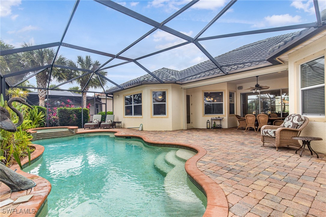 11208 Lithgow Lane Fort Myers, FL 33913 - Photo 43 of 49 a view of a house with swimming pool and sitting area