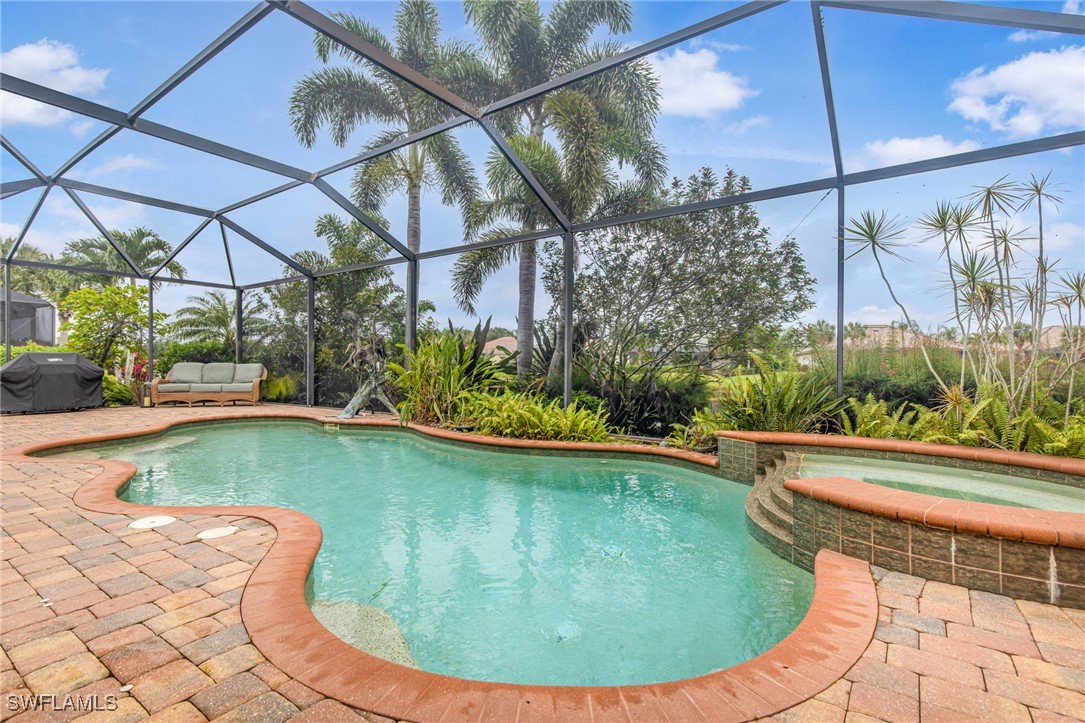 11208 Lithgow Lane Fort Myers, FL 33913 - Photo 45 of 49 a view of a swimming pool with a yard
