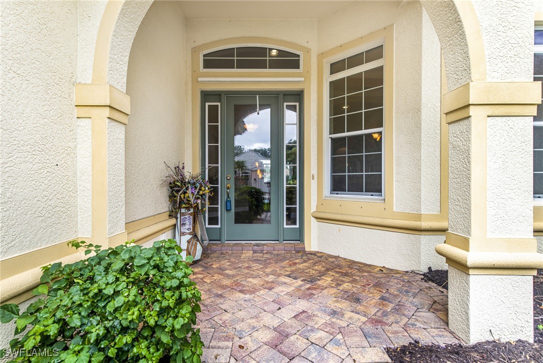 11208 Lithgow Lane Fort Myers, FL 33913 - Photo 49 of 49 a front view of a house with a yard
