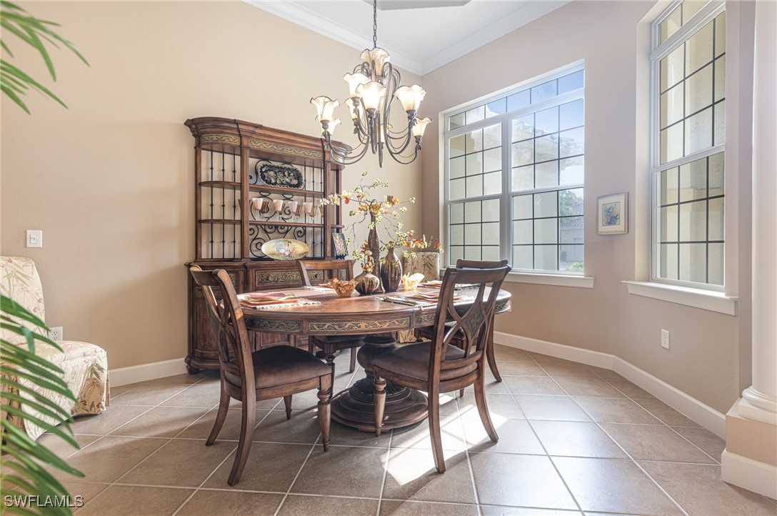 11208 Lithgow Lane Fort Myers, FL 33913 - Photo 5 of 49 a view of a dining room with furniture and chandelier