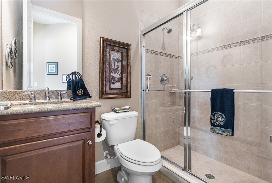 11208 Lithgow Lane Fort Myers, FL 33913 - Photo 6 of 49 a bathroom with a toilet sink and shower