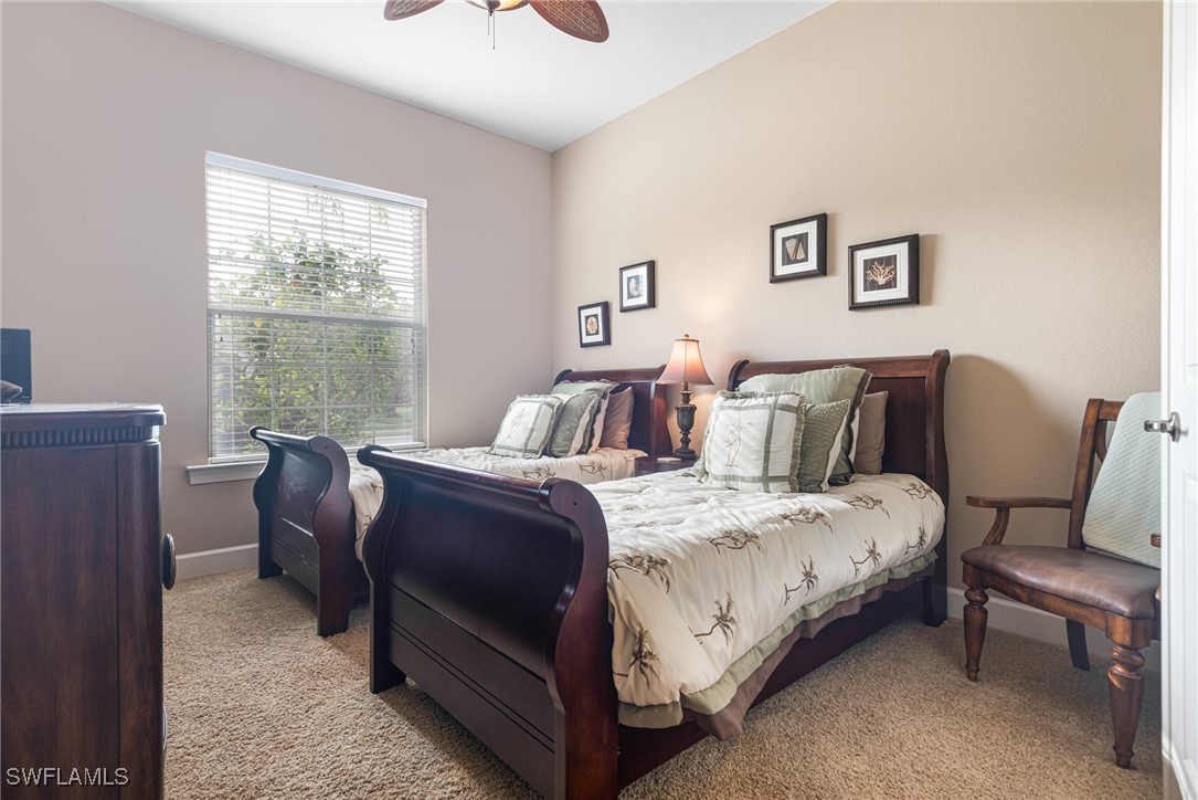 11208 Lithgow Lane Fort Myers, FL 33913 - Photo 7 of 49 a bedroom with a bed and a couch