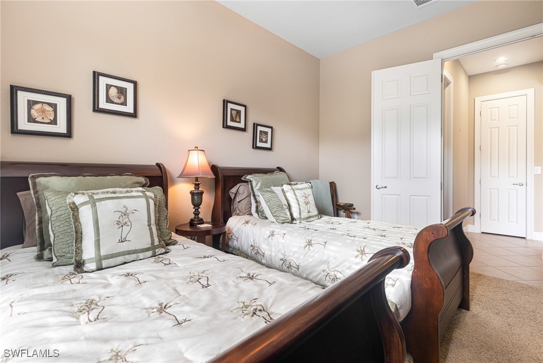 11208 Lithgow Lane Fort Myers, FL 33913 - Photo 9 of 49 a bed room with two bed