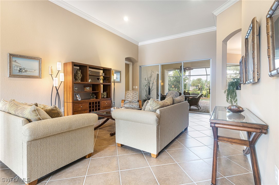 11208 Lithgow Lane Fort Myers, FL 33913 - Photo 10 of 49 a living room with furniture and a large window