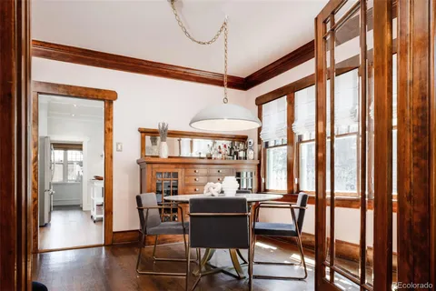 a dining room with furniture and window