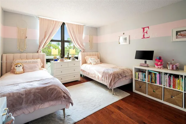 a bedroom with bed and a large window