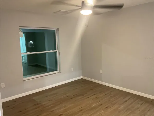 a bathroom with a shower and a mirror