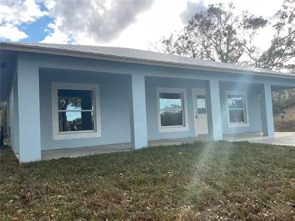 a view of backyard of a house