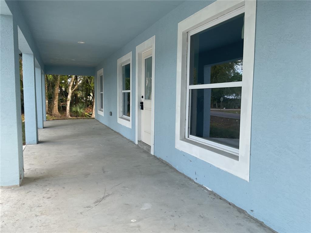 2432 Northwest 5th Street Okeechobee, FL 34972 - Photo 8 of 24 a view of a room with window and front door