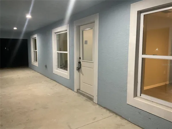 a large kitchen with stainless steel appliances granite countertop a stove a sink and a refrigerator