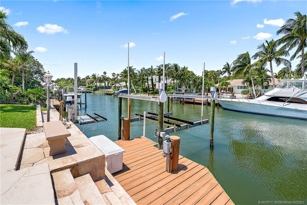 19 Island Road Sewall's Point, FL 34996 - Photo 11 of 50 a view of a lake with couches chairs