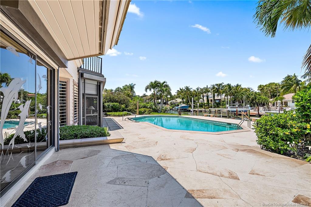 19 Island Road Sewall's Point, FL 34996 - Photo 17 of 50 a view of swimming pool with outdoor seating and plants