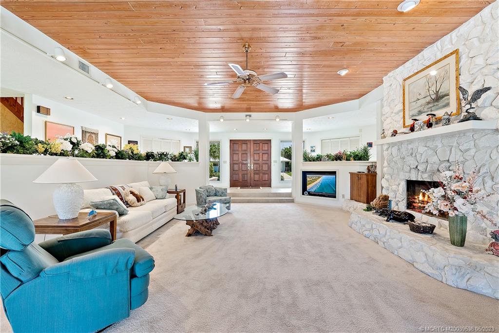 19 Island Road Sewall's Point, FL 34996 - Photo 23 of 50 a living room with furniture and a fireplace