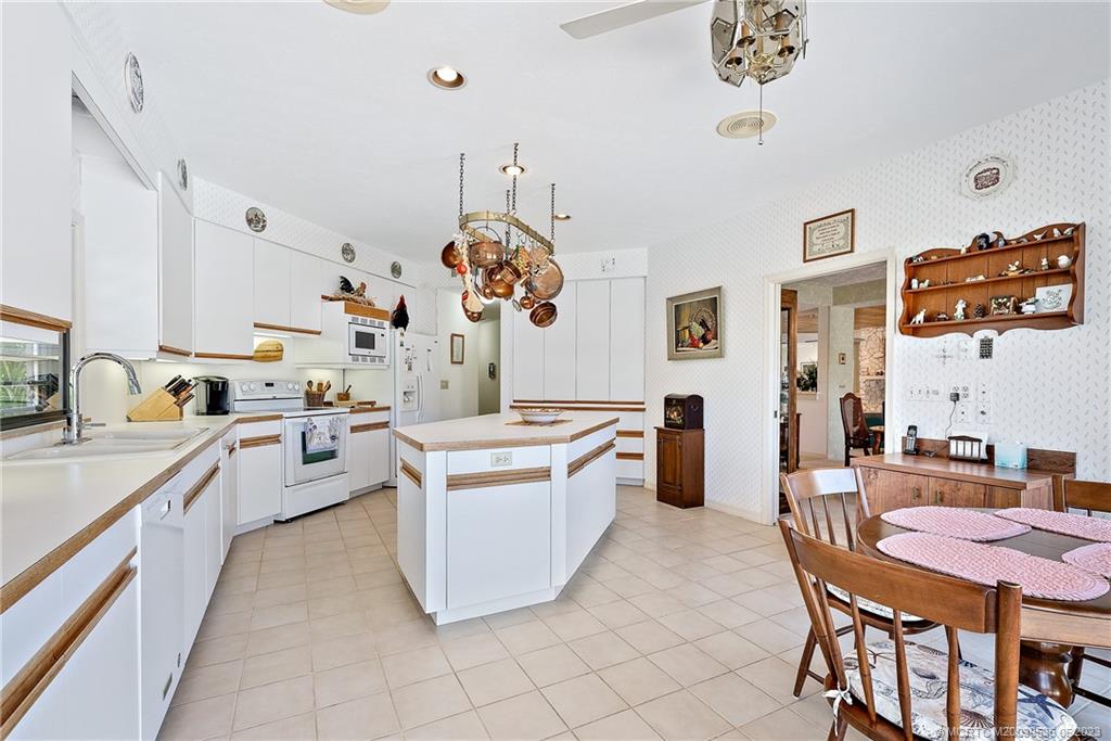 19 Island Road Sewall's Point, FL 34996 - Photo 26 of 50 a kitchen with a sink counter top space and appliances