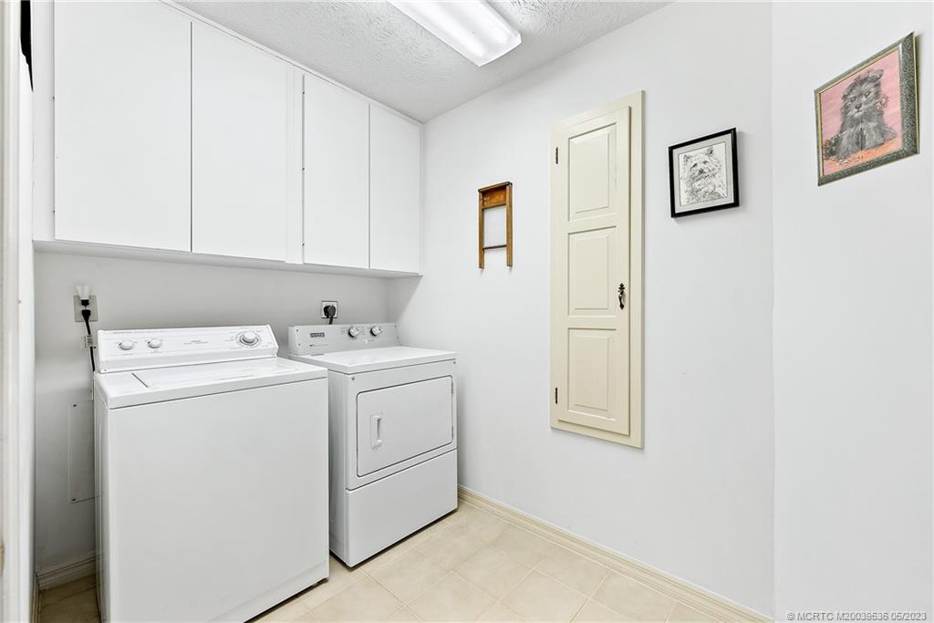 19 Island Road Sewall's Point, FL 34996 - Photo 29 of 50 a utility room with dryer and washer