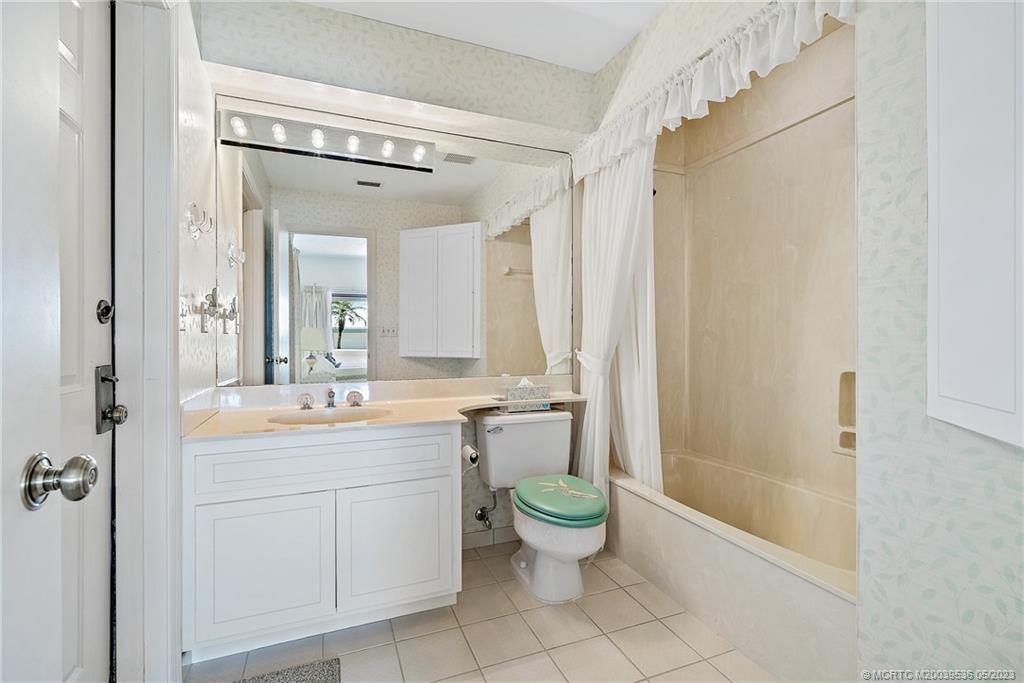 19 Island Road Sewall's Point, FL 34996 - Photo 31 of 50 a bathroom with a double vanity sink mirror and toilet